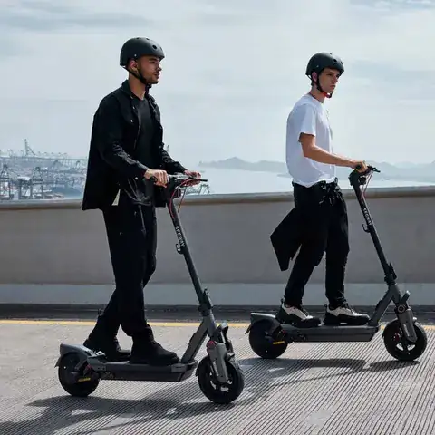 Two riders on Segway e-scooters